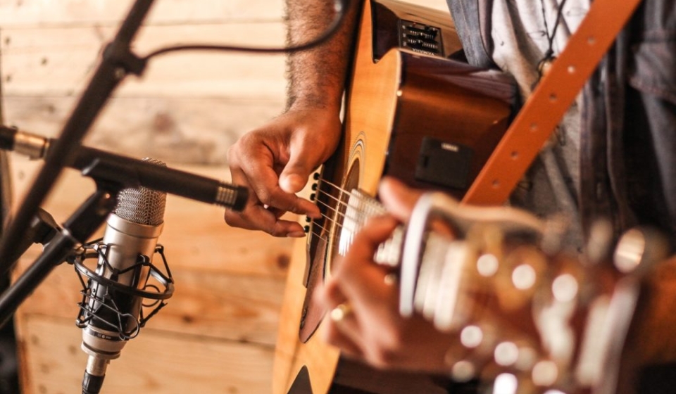 person-playing-acoustic-guitar-2291538-1024x682